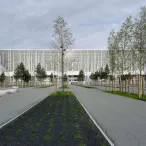Vue architecturale d'un bâtiment moderne aux façades de métal blanc ajouré, avec une allée centrale plantée d'arbres et de zones vertes, situé à Bordeaux.