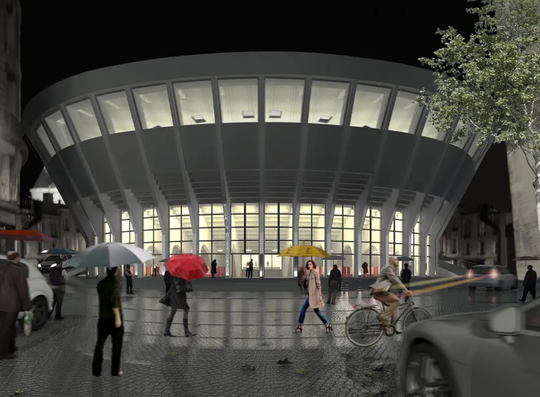 Vue nocturne du Palais des Sports de Bordeaux avec sa façade incurvée illuminée, une place publique animée avec des piétons, des cyclistes et des voitures
