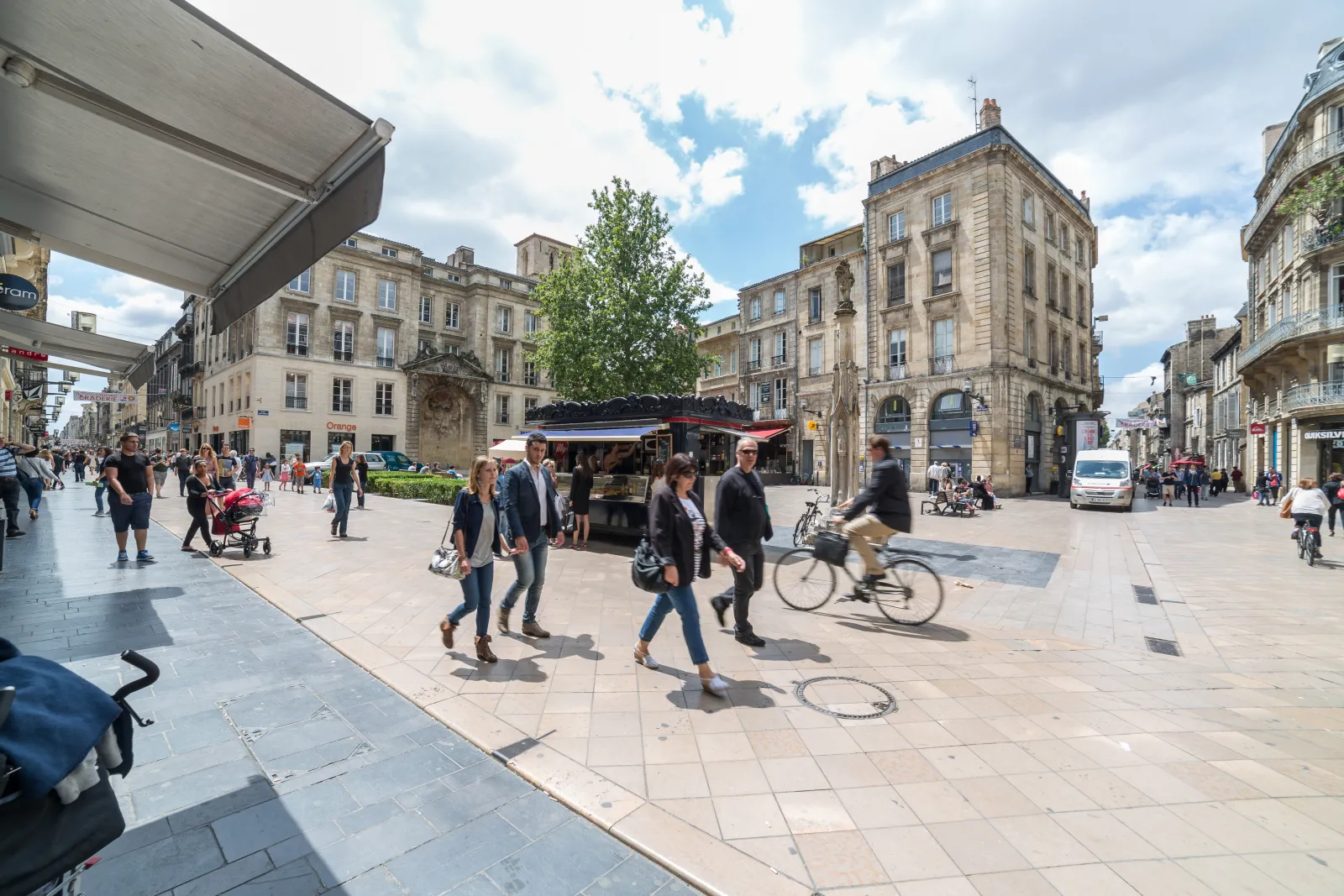 Pedestrians and cyclists on Rue Sainte-Catherine, Bordeaux's famous shopping street